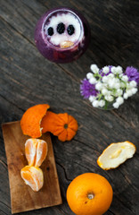 Yogurt with blueberry sauce and oranges