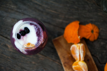 Yogurt with blueberry sauce and oranges