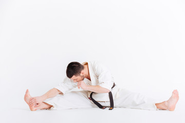 Man in kimono limbering up