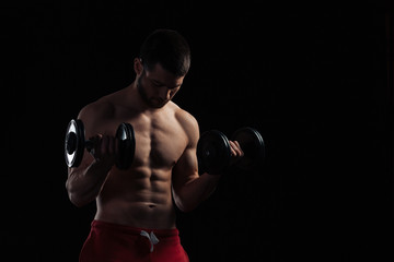 Handsome man workout with dumbbells