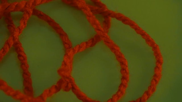 Someone is Pulling Red Thread up Yarn Green Screen Colorful Filament Fiber Clue Funiculus Threads Are Moving Red Thread is Removed Wool Thread is Moving