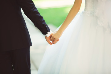 holding hands on the sunset