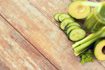 close up of fresh green juice glass and vegetables