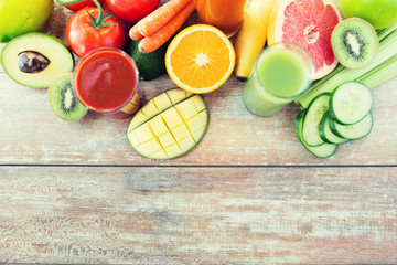 close up of fresh juice glass and fruits on table