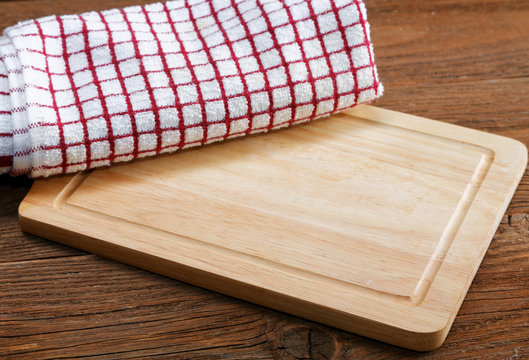 kitchen towels and cutting board on a table