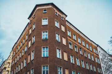 Fototapeta na wymiar brown facaded building with blue windows