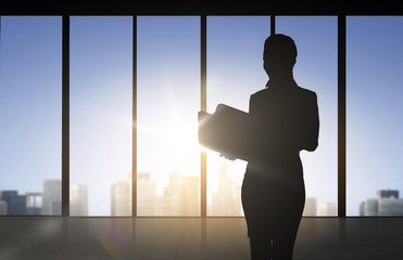 Fototapeta na wymiar silhouette of business woman with folders