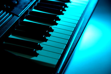 Beautiful new baby grand piano keyboard, ready to be played.
