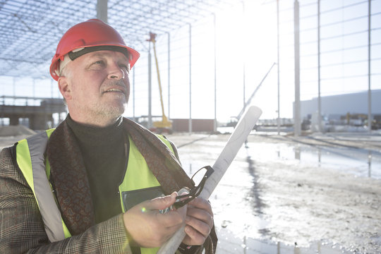 Architect looking up on construction site