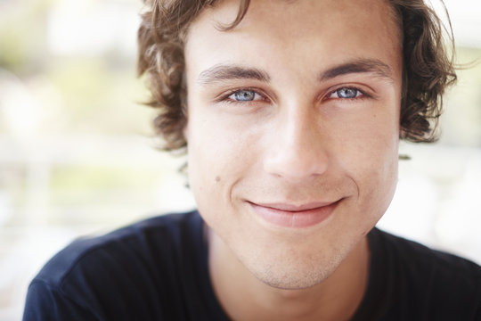 Close up portrait of young man with blue eyes