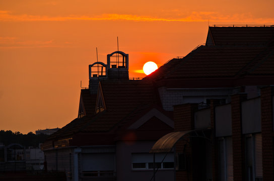 Sunrise over the top of a building roof in Belgrade, Serbia