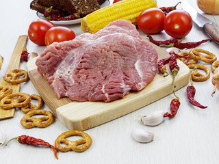 fresh pork steak on wooden Board