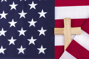 Wooden cross wrapped in American flag