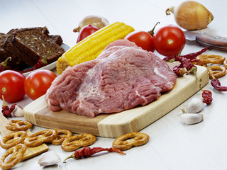 fresh pork steak on wooden Board