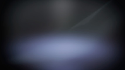 Blue blurred spotlight, dark abstract background