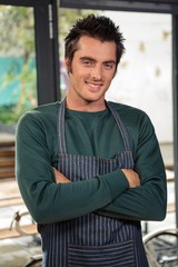 Fototapeta premium Waiter posing with crossed arms