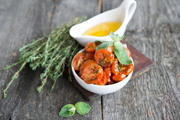 Tomatoes dried with herbs in olive oil 