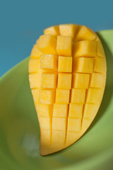 Sweet Mango slice on green plate