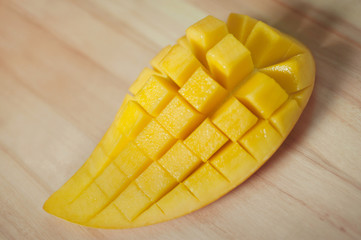 sweet mango slice on wood floor