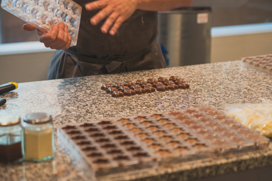 hands of worker by chocolate production