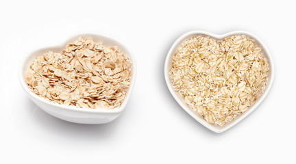 Oat in a heart shaped bowl, isolated on white