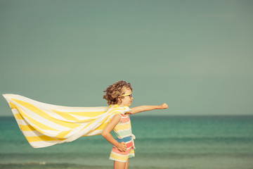 Child having fun on the beach