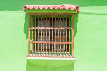 View of the window of one of the colorful houses in center of Cartagena, Colombia.