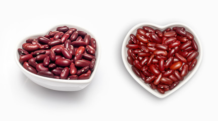 red beans  in a heart shaped bowl, isolated on white