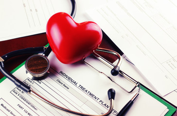cardiologist stethoscope paper insurance
