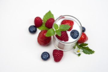 Natural yogurt with fresh berries mixed  isolated on withe..