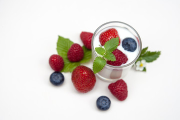 Natural yogurt with fresh berries mixed  isolated on withe..
