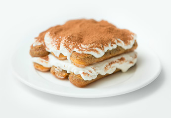 Tiramisu on white plate