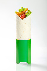 Tortilla with meat and vegetables on grey background