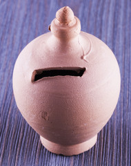 Money box over wooden table