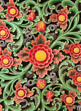 Wooden colorful floral carving decorative panel Textural background.