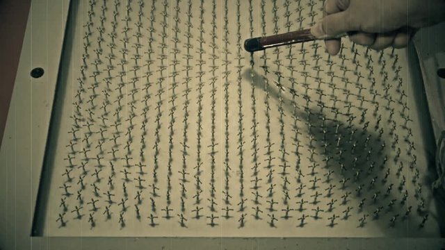 Old raw footage retro film grain of science experiment of scientist testing magnetic field with magnet in HD size 