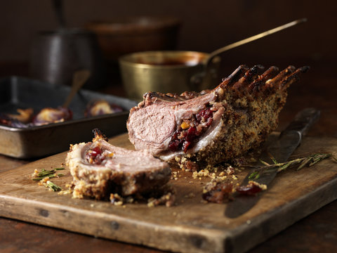 Christmas dinner. Lamb rack rare medium with cranberry and clementine stuffing and rosemary