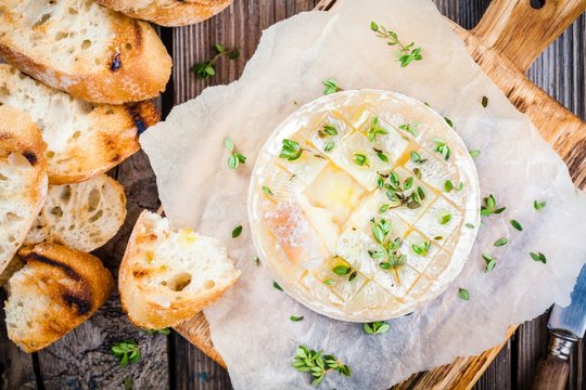 Baked camembert with toasts and thyme