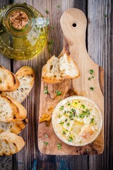 Baked camembert with toasts and thyme