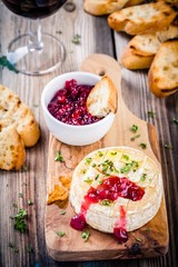 Baked camembert with cranberry sauce and thyme