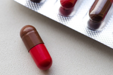 Medicine capsule / Brown with red capsules in blister