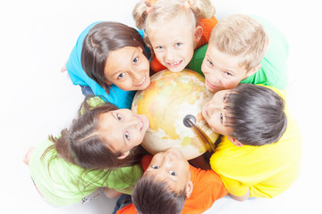 Fototapeta na wymiar Group of international kids holding globe earth