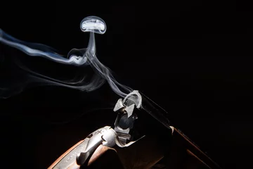 Foto auf Glas Smoke from a hunting rifle after firing © river34