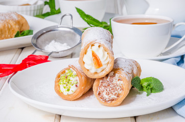 Homemade cannoli stuffed with ricotta cheese cream