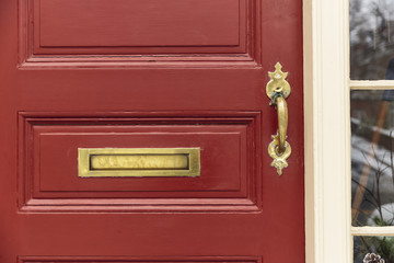 Naklejka premium Front door, red with brass fixtures