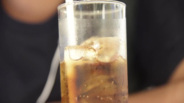 Unknown man drink a glass of iced cola with bubble  closeup full HD .