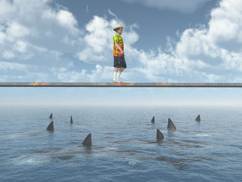 Mann balanciert auf einem Brett über dem Meer mit Haifischen