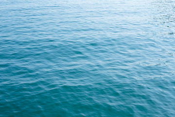 Blue sea surface with waves
