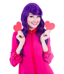 woman in pink with purple hair holding paper hearts isolated on