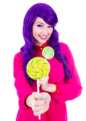 funny woman with purple hair giving colorful lollipop isolated o